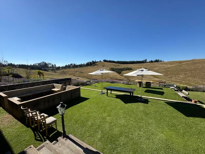 Lawns and rolling hills under a blue sky at Brahman Hills