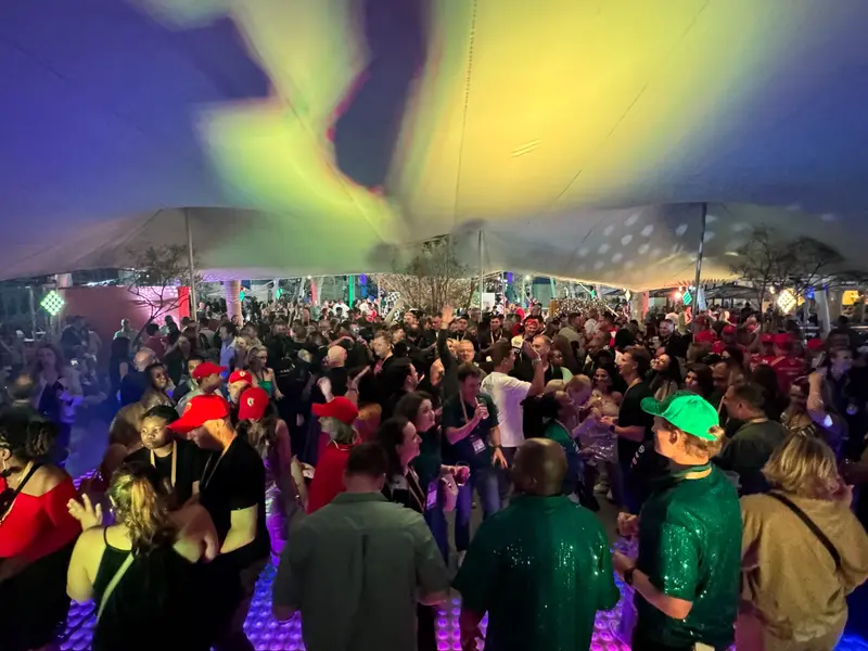 A packed dancefloor under coloured tent lights at the SACSC After Party in Umhlanga
