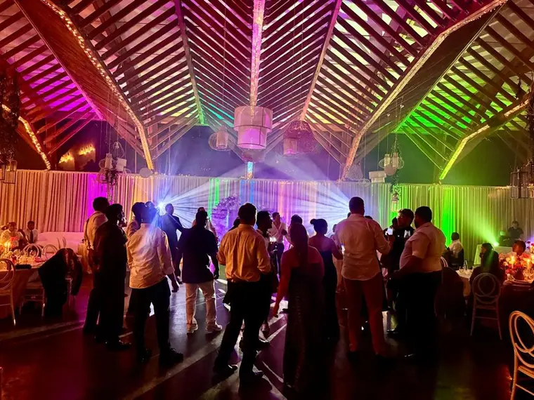 Moving head lighting over a packed wedding dancefloor at Brahman Hills