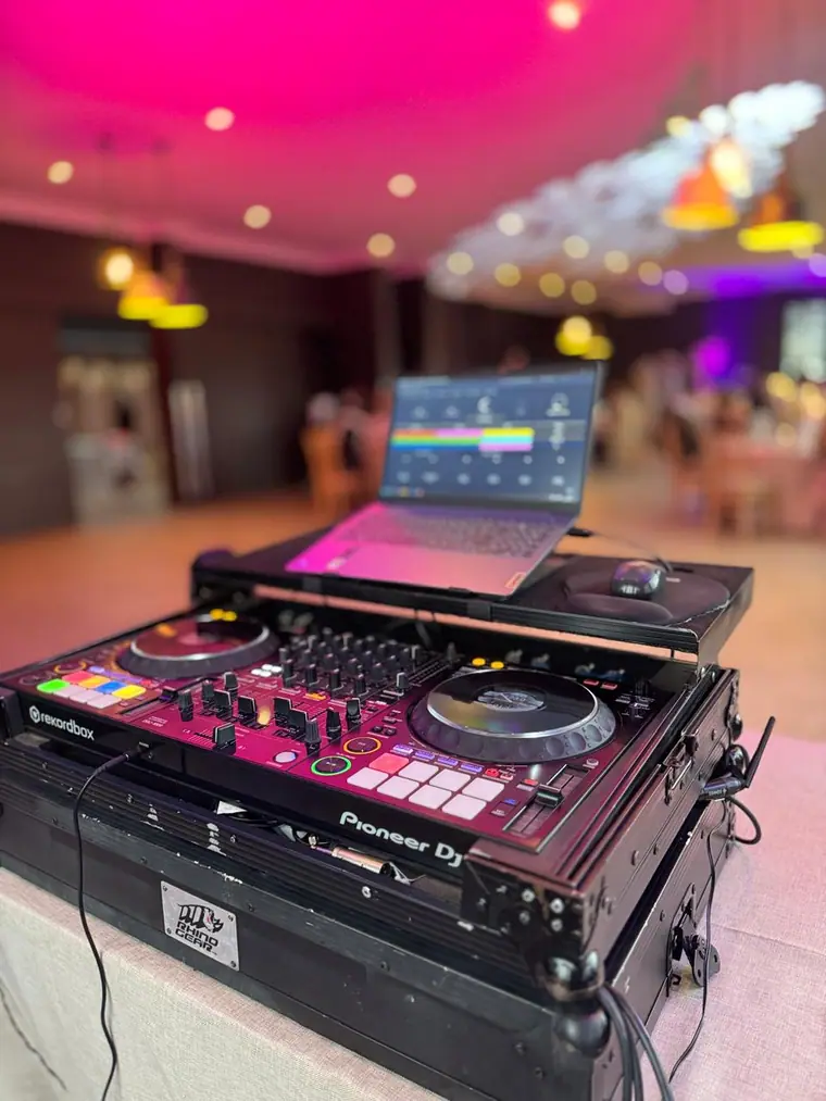 DJ controller and booth ready before a wedding reception