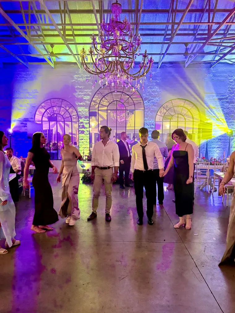 Guests on the dancefloor under warm uplighting at a Midlands wedding venue