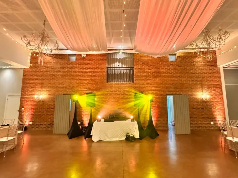 Top table and draped ceiling lit warm before guests arrive at Fordoun