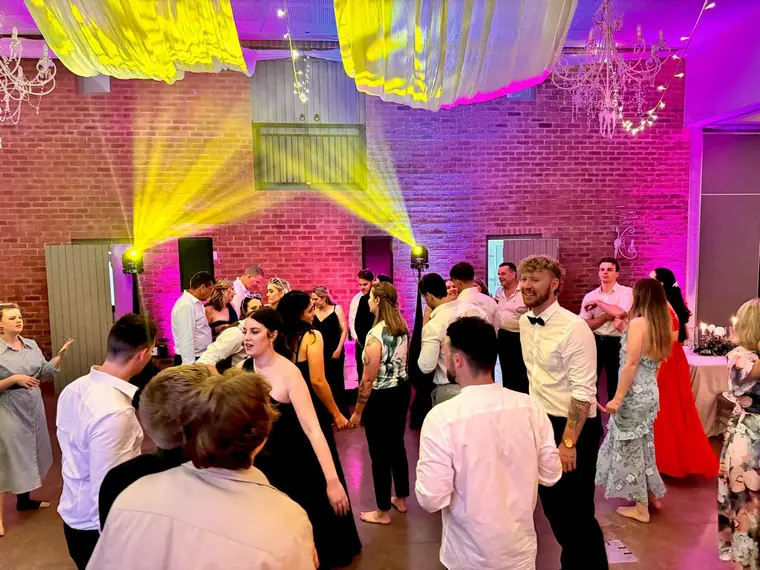 Wedding guests dancing beneath the draped ceiling at Fordoun