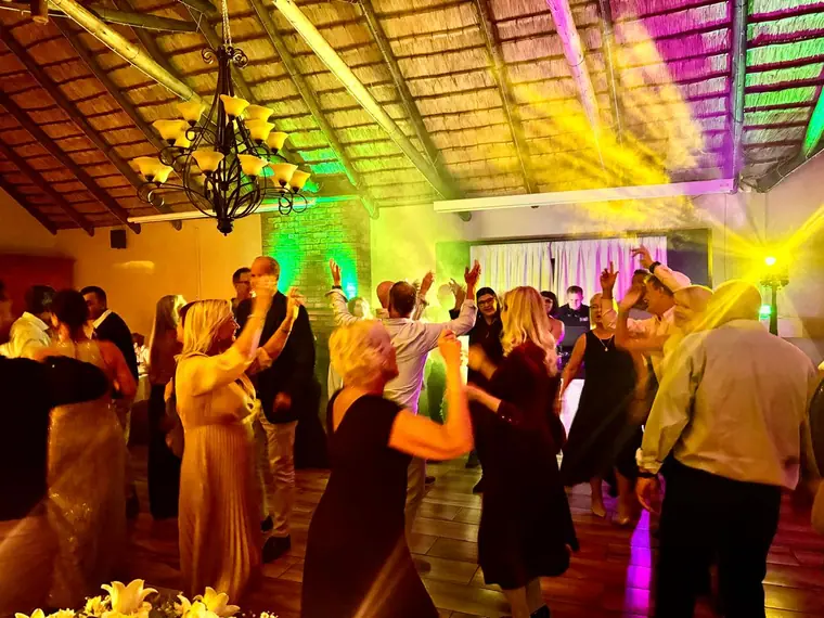 Dancing beneath the chandelier at Granny Mouse Country House