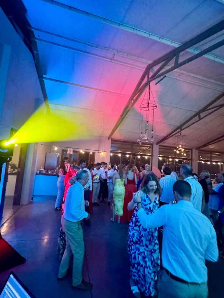 Colour washing the trussed roof over a packed dancefloor at Sweet Home
