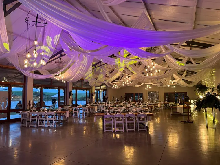 Draped ceiling and dressed tables overlooking the dam at Sweet Home