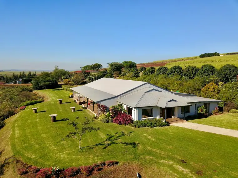 The Sweet Home wedding venue and its lawns above the Eston sugarcane fields