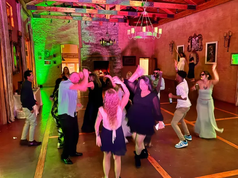 Dancefloor lit green and pink at a The Gallery wedding