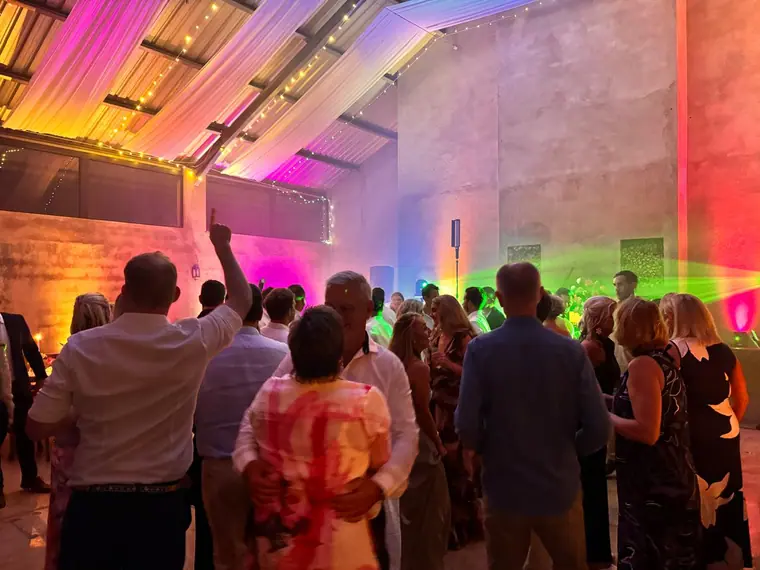 Colour across the barn walls and draped roof at a Wingrove Valley wedding